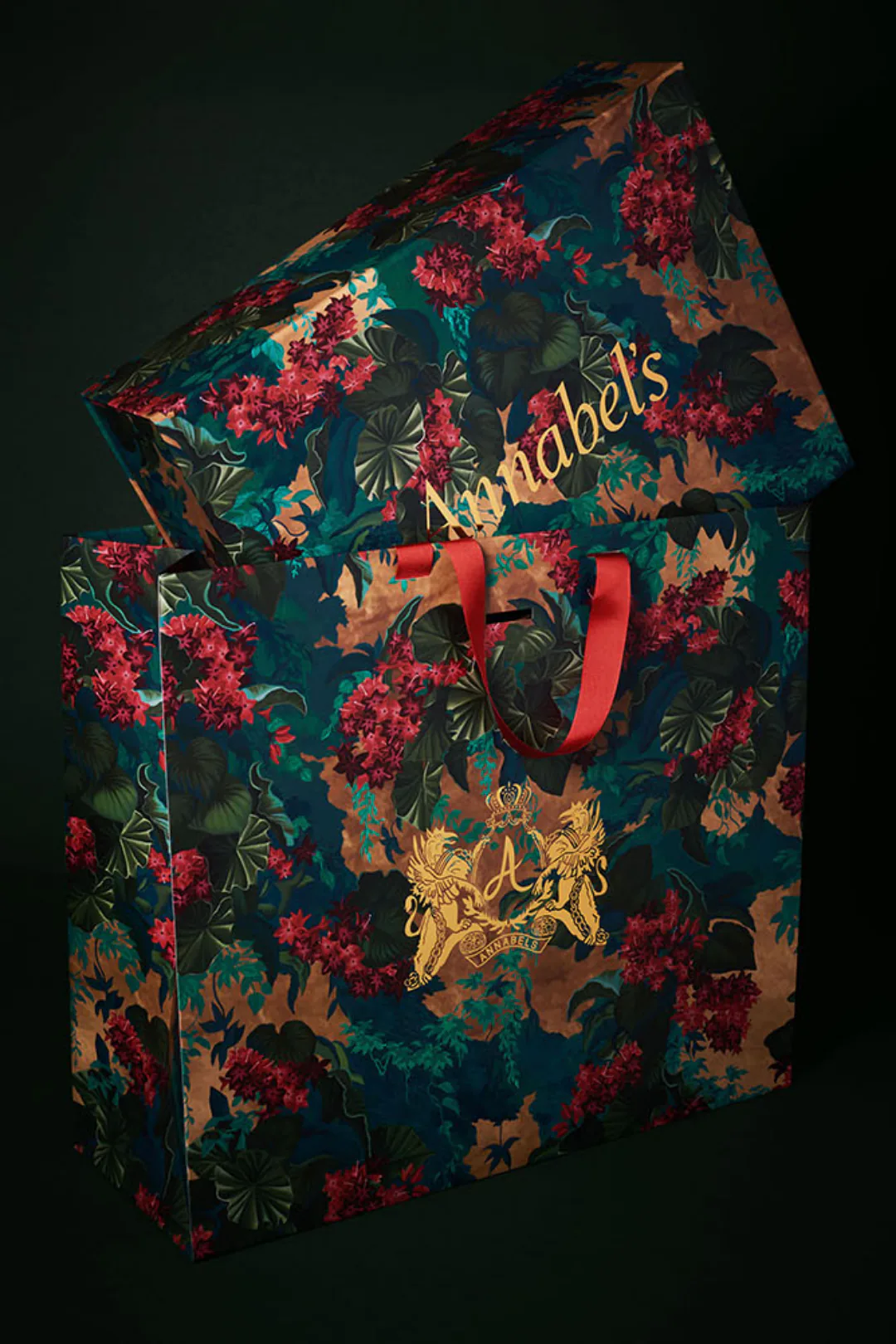 The gift box and carrier bag stacked together, both in the floral print.