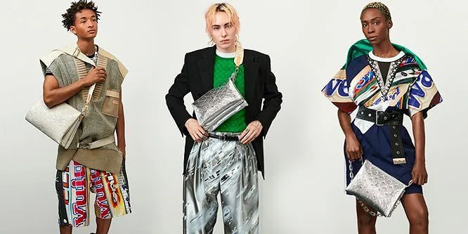 Three models in printed and metallic streetwear, each holding a silver clutch.