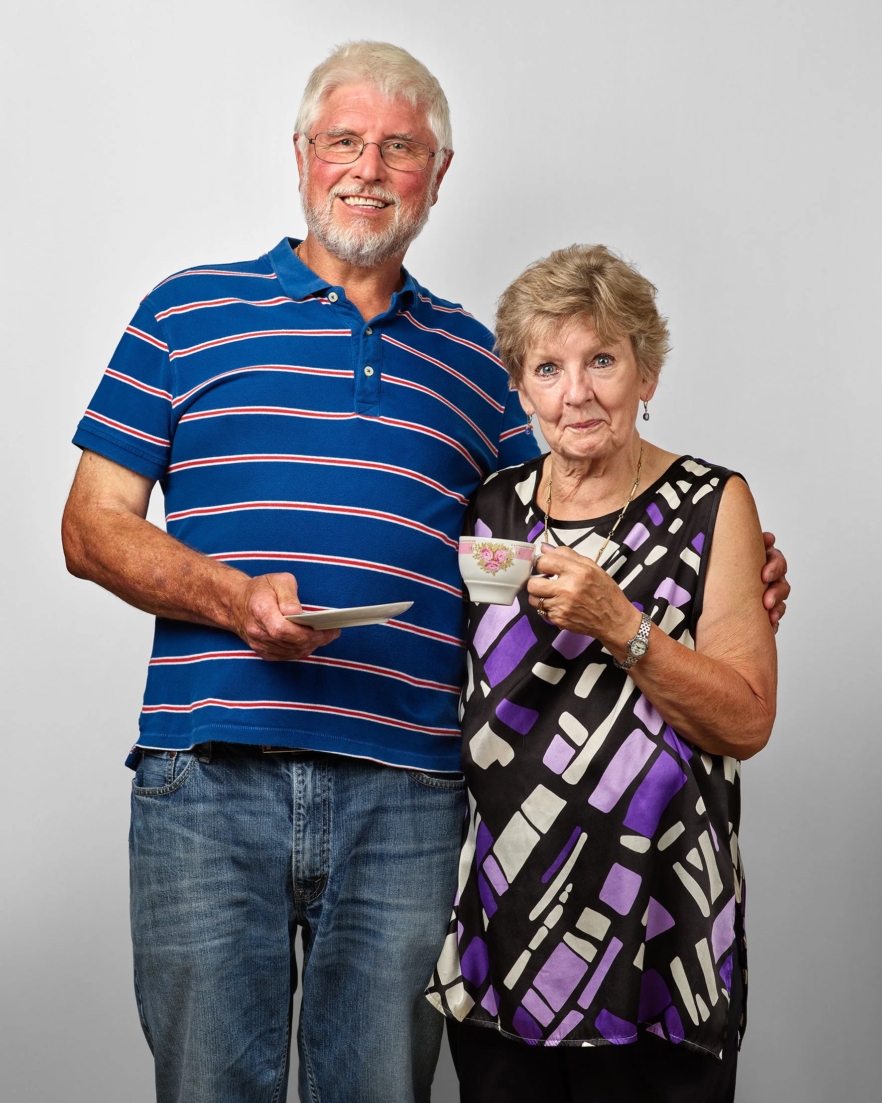 The collector of the teapots, photographed with them.