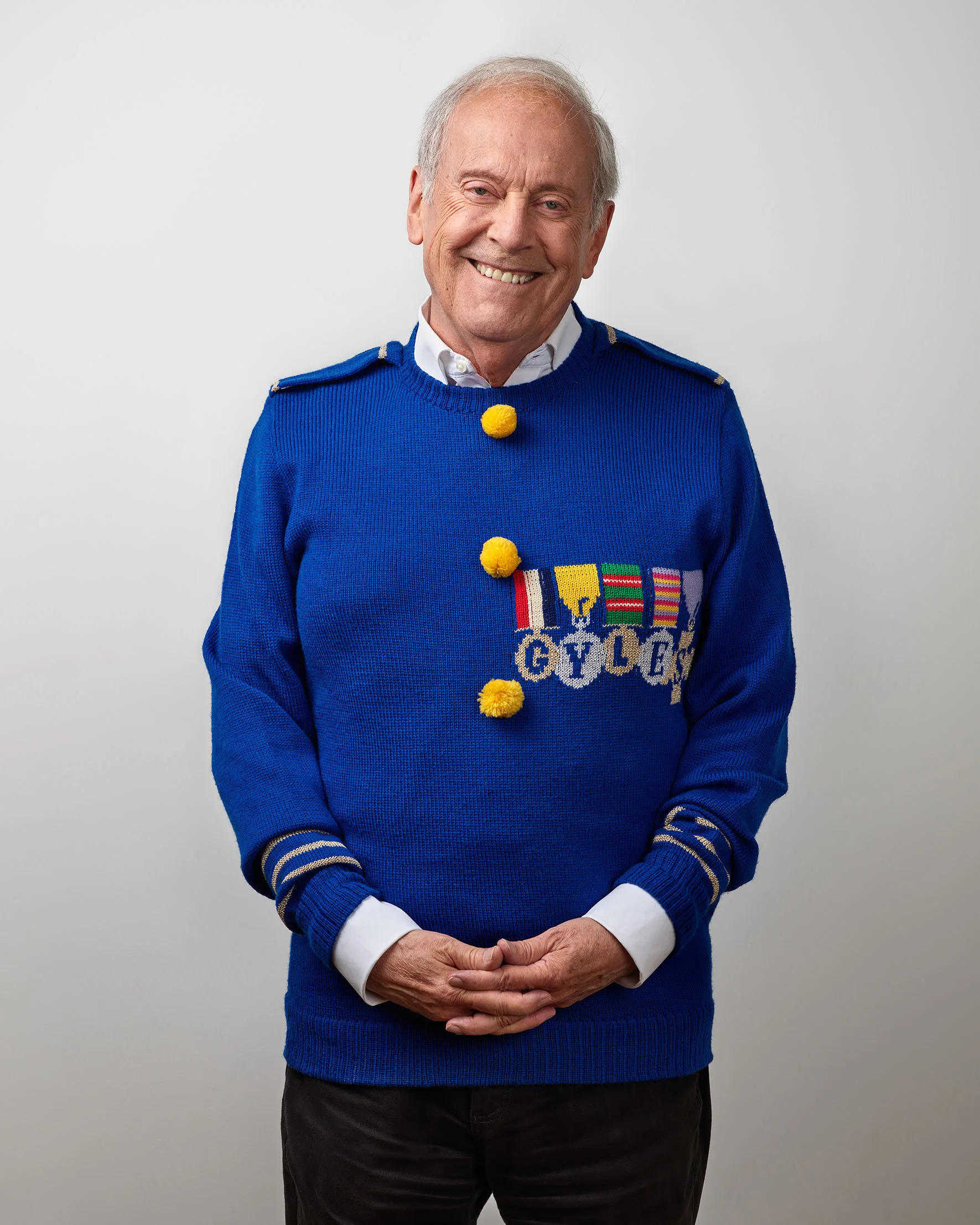 The collector of the knitwear, photographed with it.