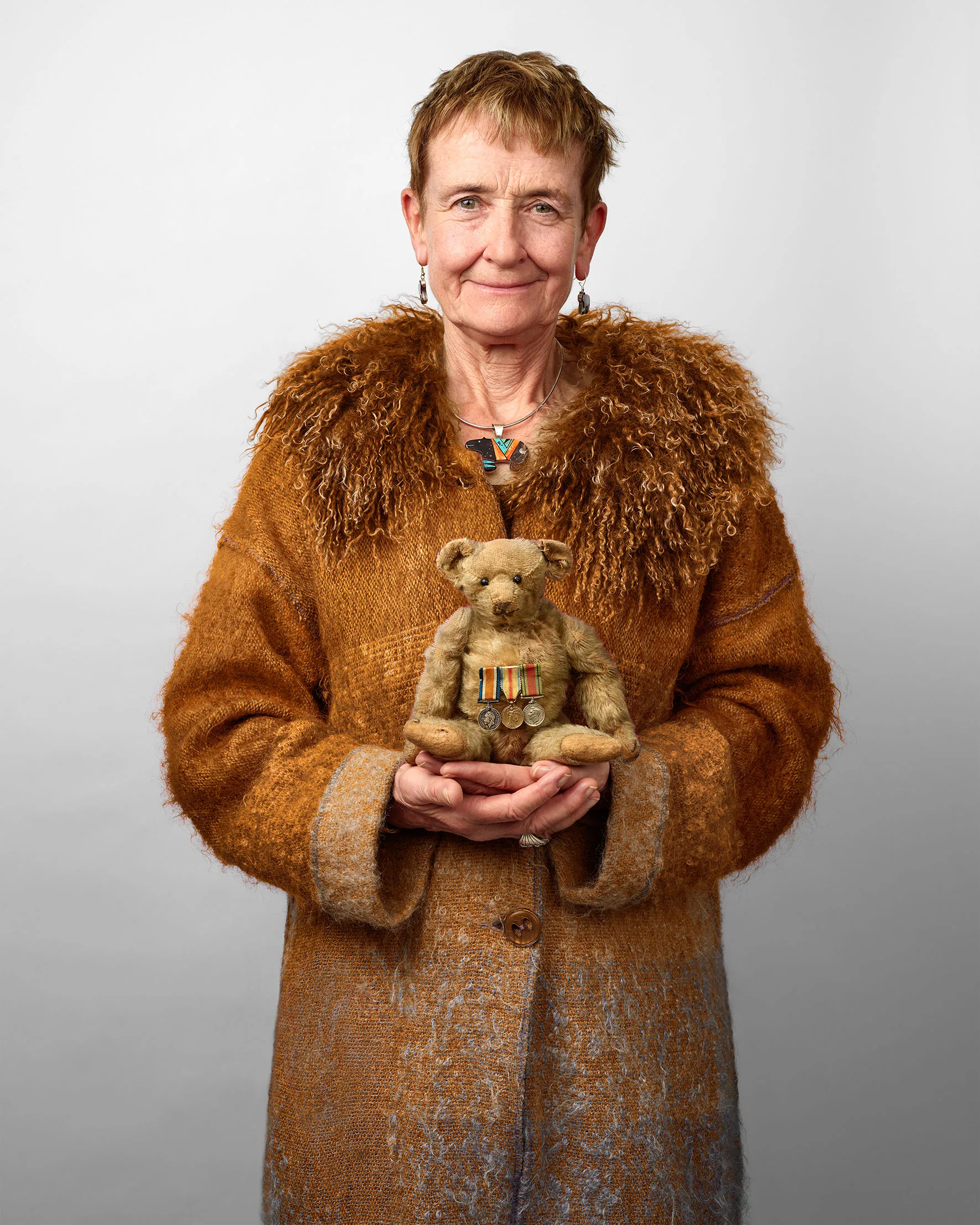 The collector of the teddy bears, photographed with them.
