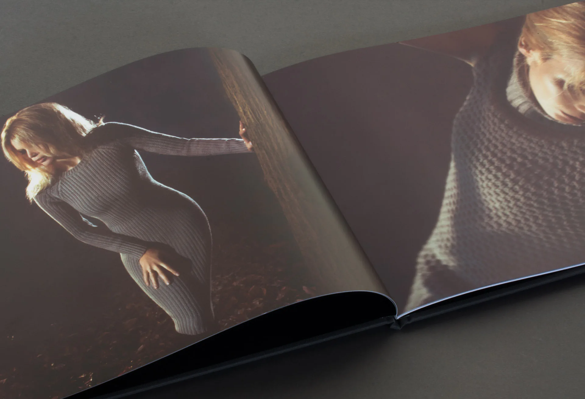 A lookbook open on a spread of the cashmere campaign.