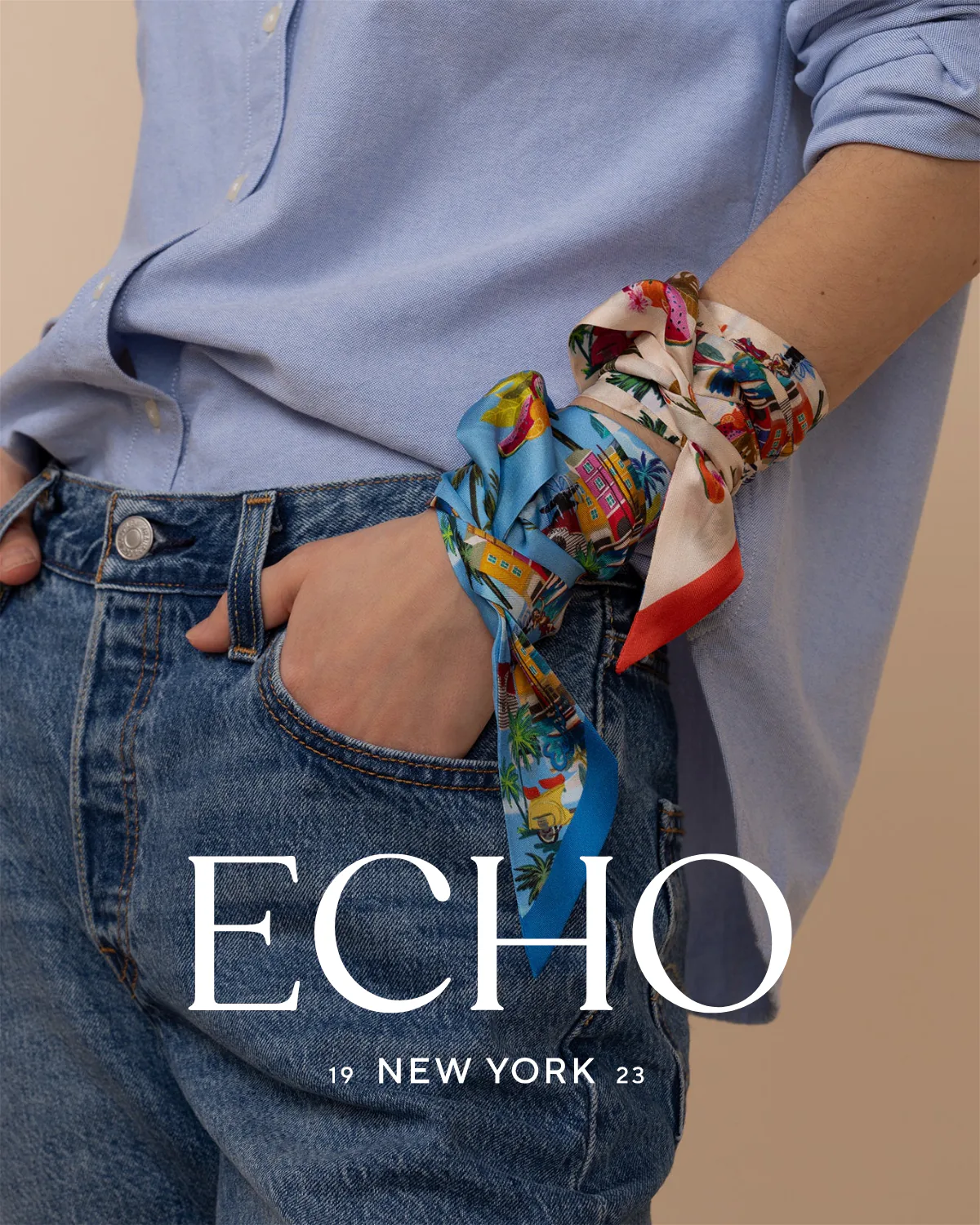 A scarf knotted at the wrist over a blue shirt and jeans, under the ECHO New York lockup.