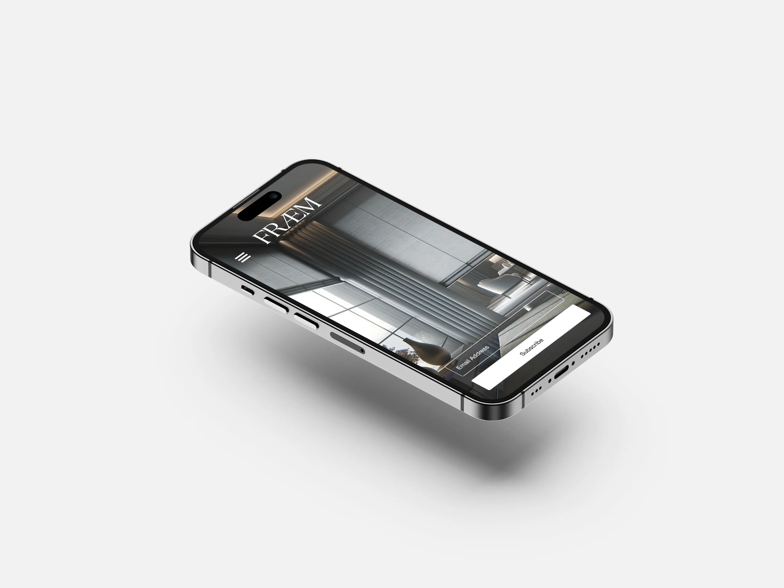 A phone showing the FRAEM site, an interior filling the screen.