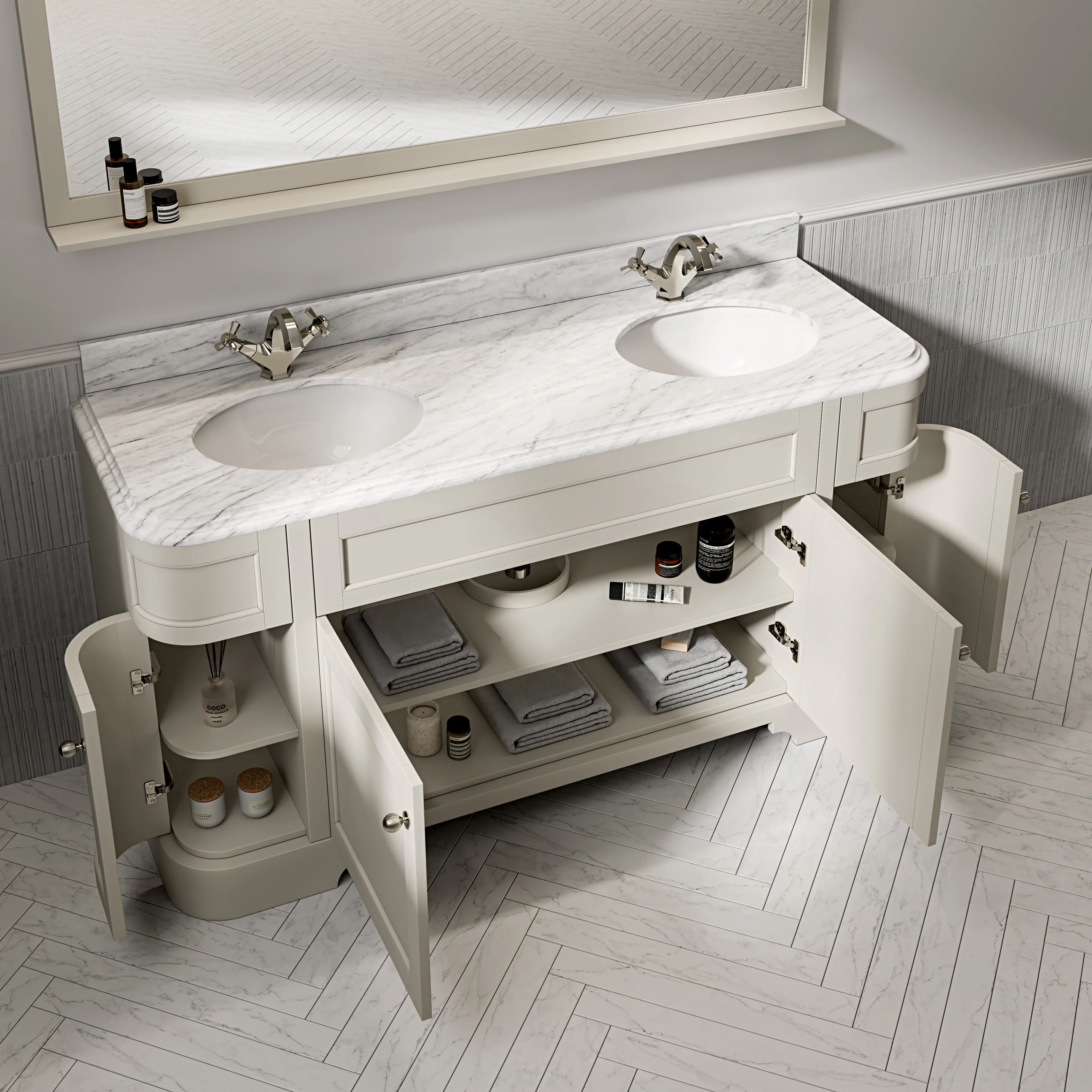 A pale double vanity with a marble top and two basins, its cupboard doors open.