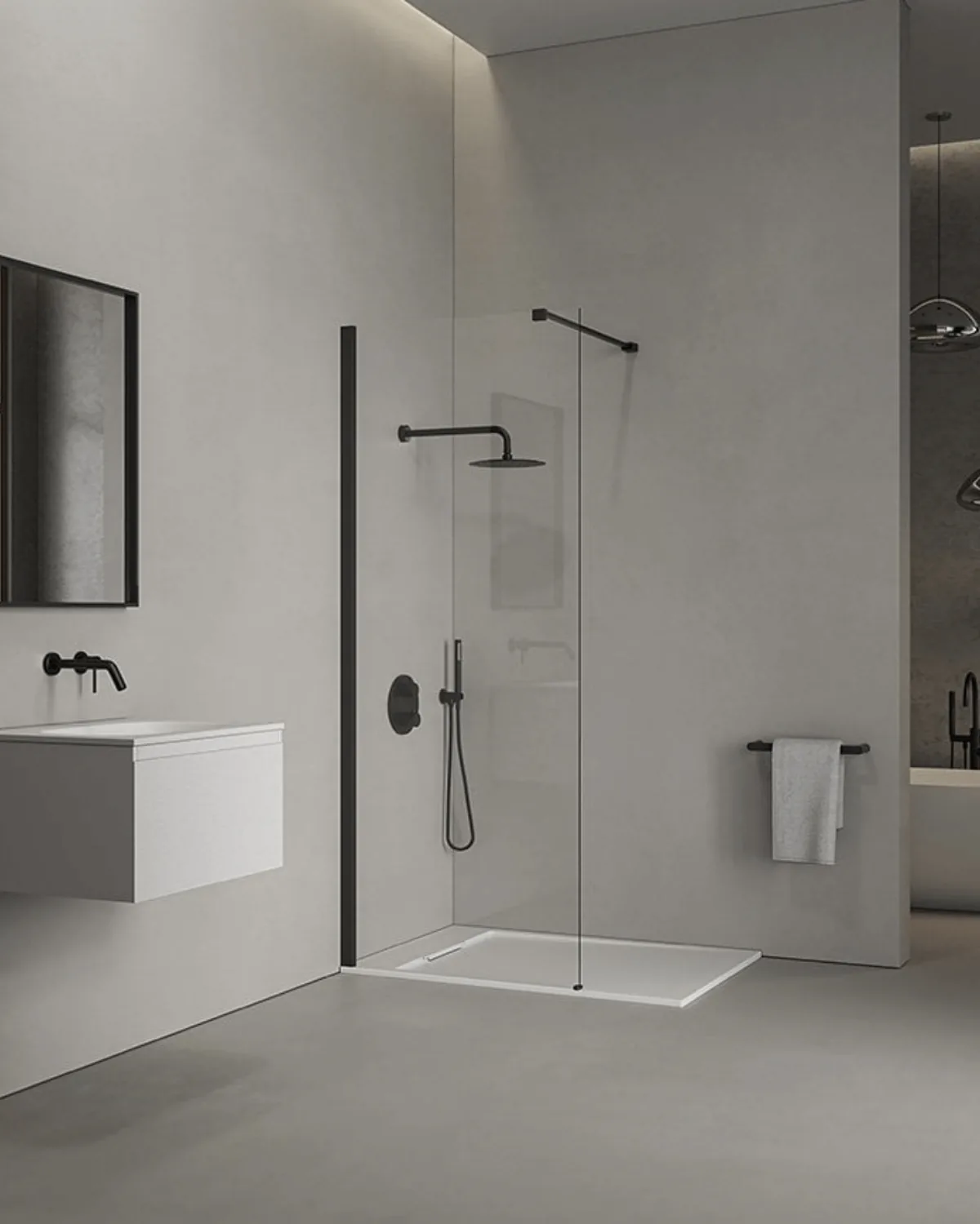A walk-in shower with a wall-hung basin alongside.