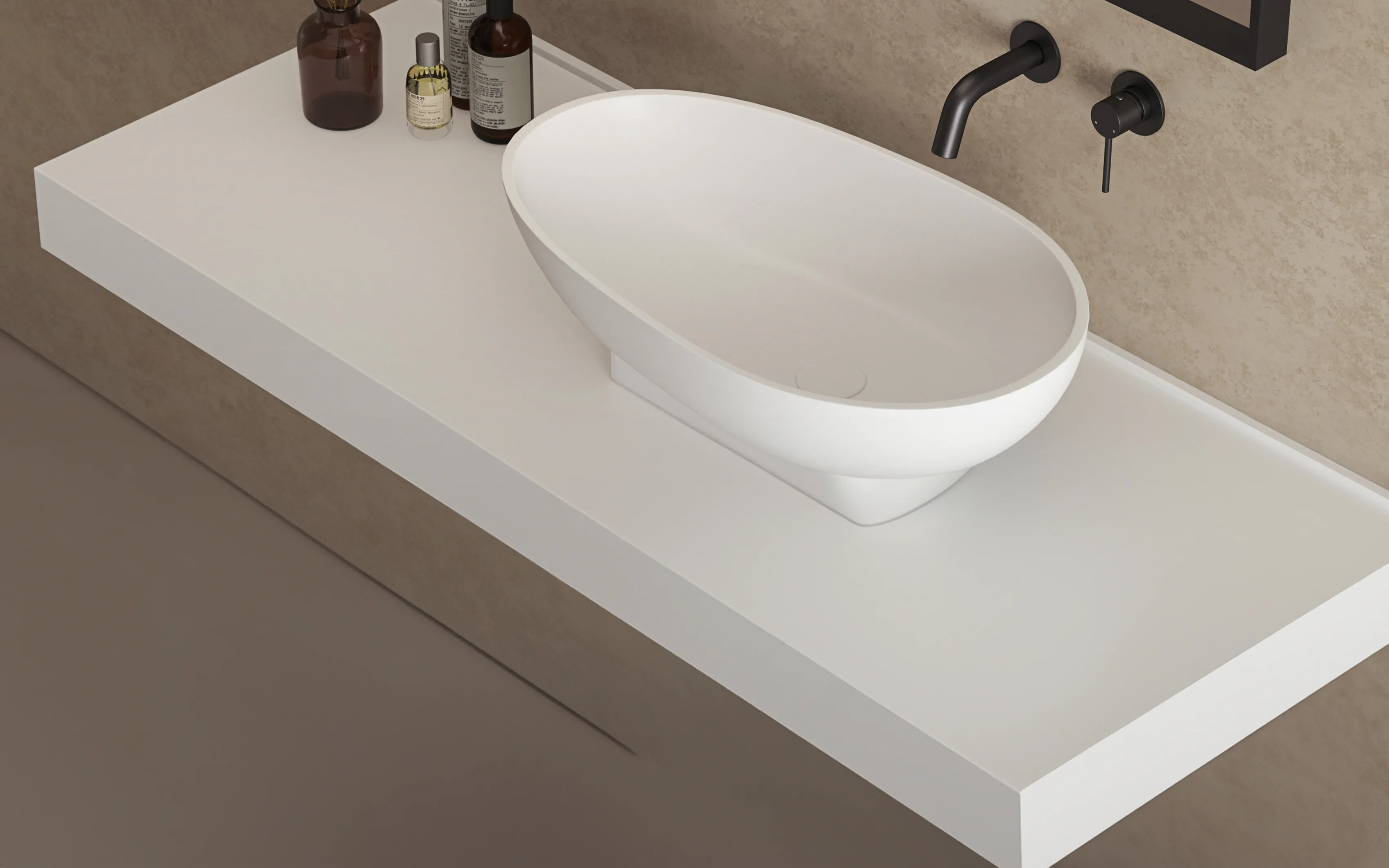 A countertop basin on a stone shelf, with wall-mounted taps.