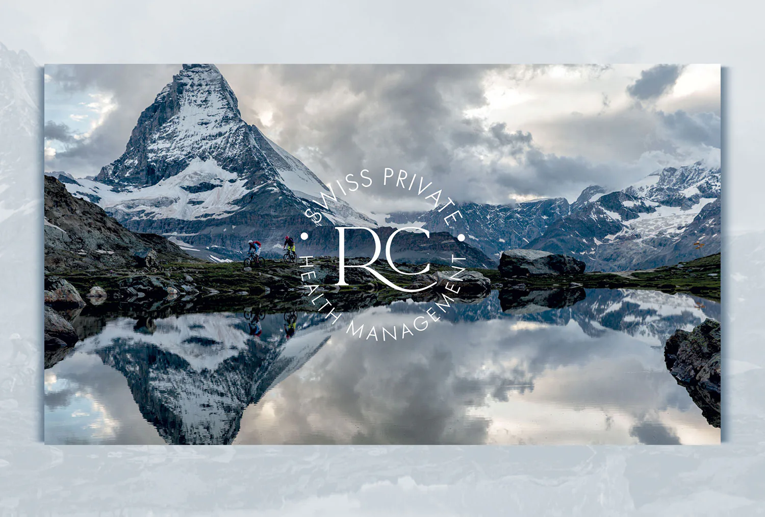 The Matterhorn mirrored in a still lake, with the Ridge Club monogram over it.