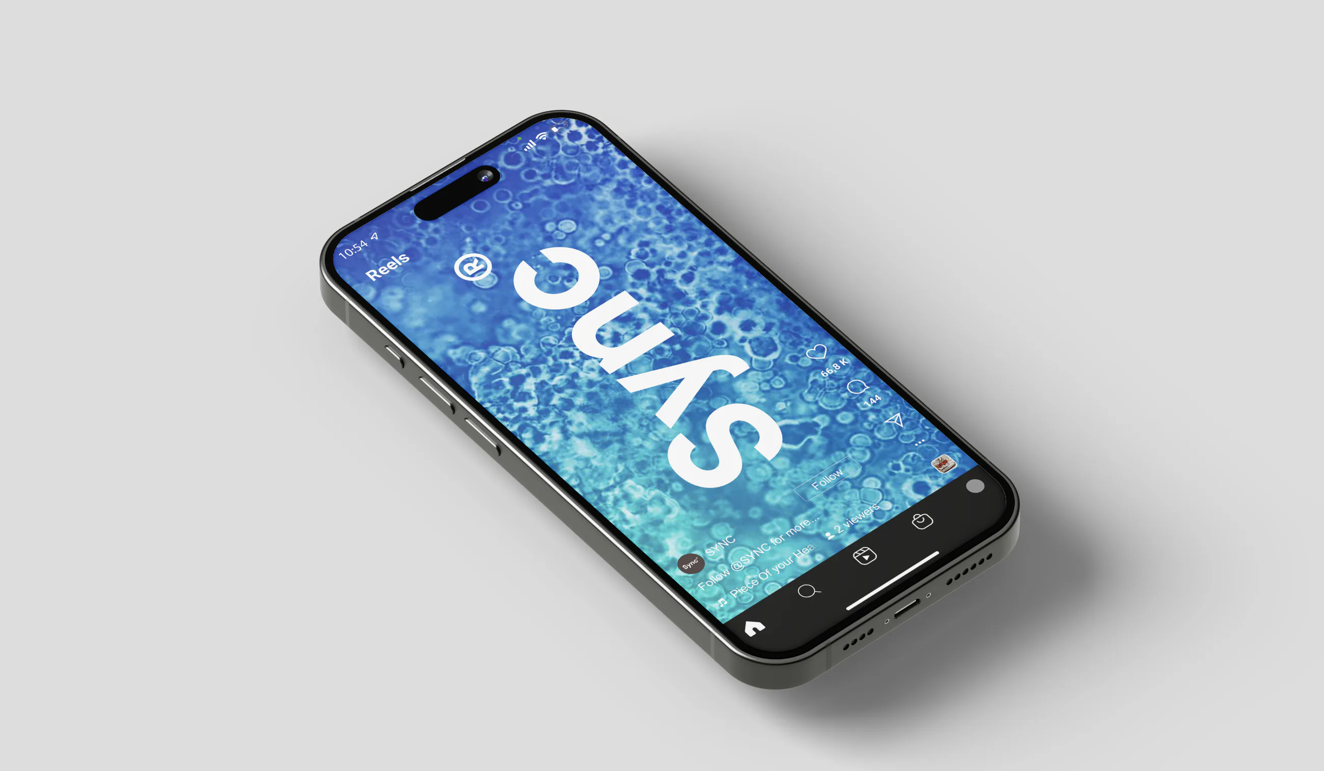A phone lying on grey, its screen showing the Sync wordmark over rippling water.