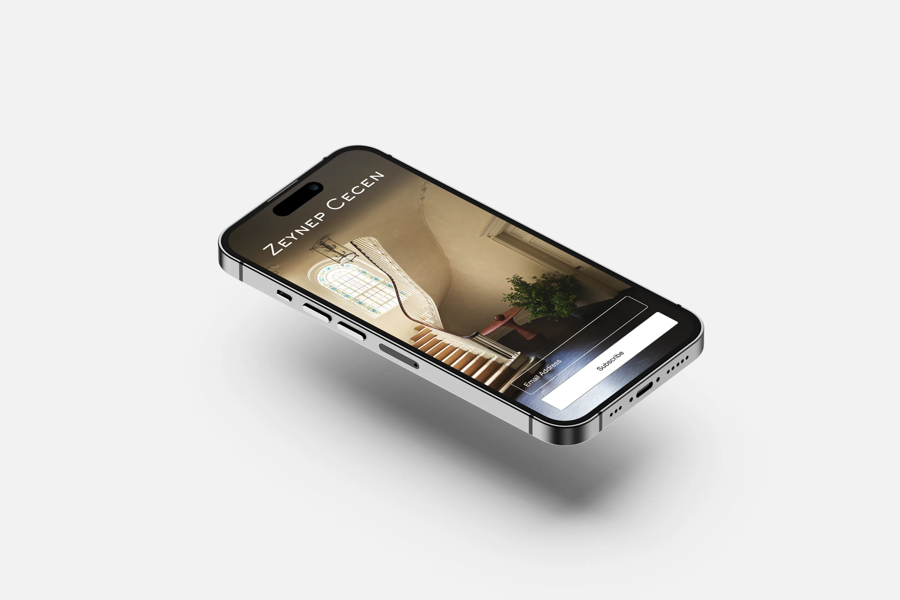 A phone showing the Zeynep Cecen site, an interior filling the screen.